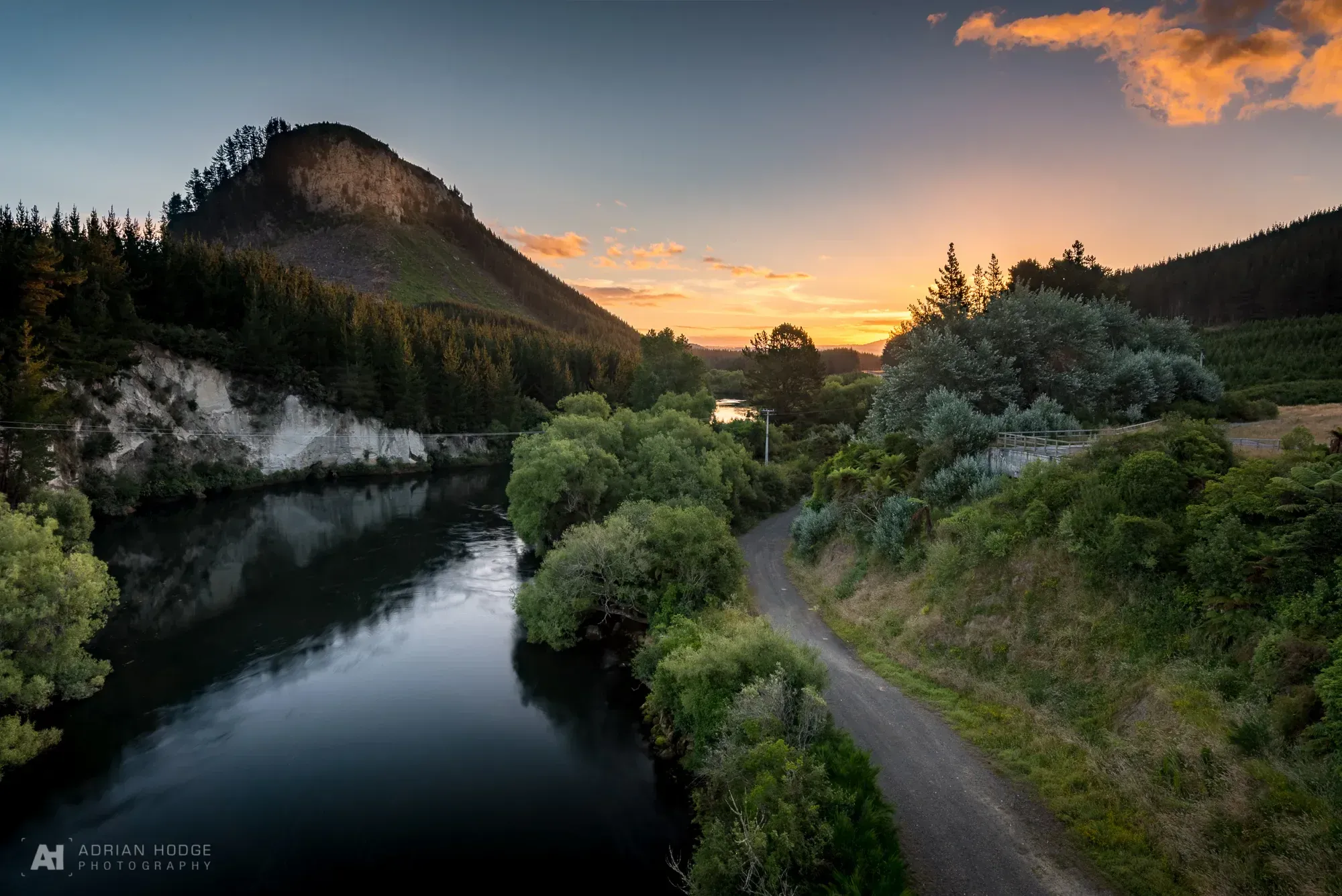 Tranquil Atiamuri landscape at sunset with serene river and lush forest, perfect for outdoor activities