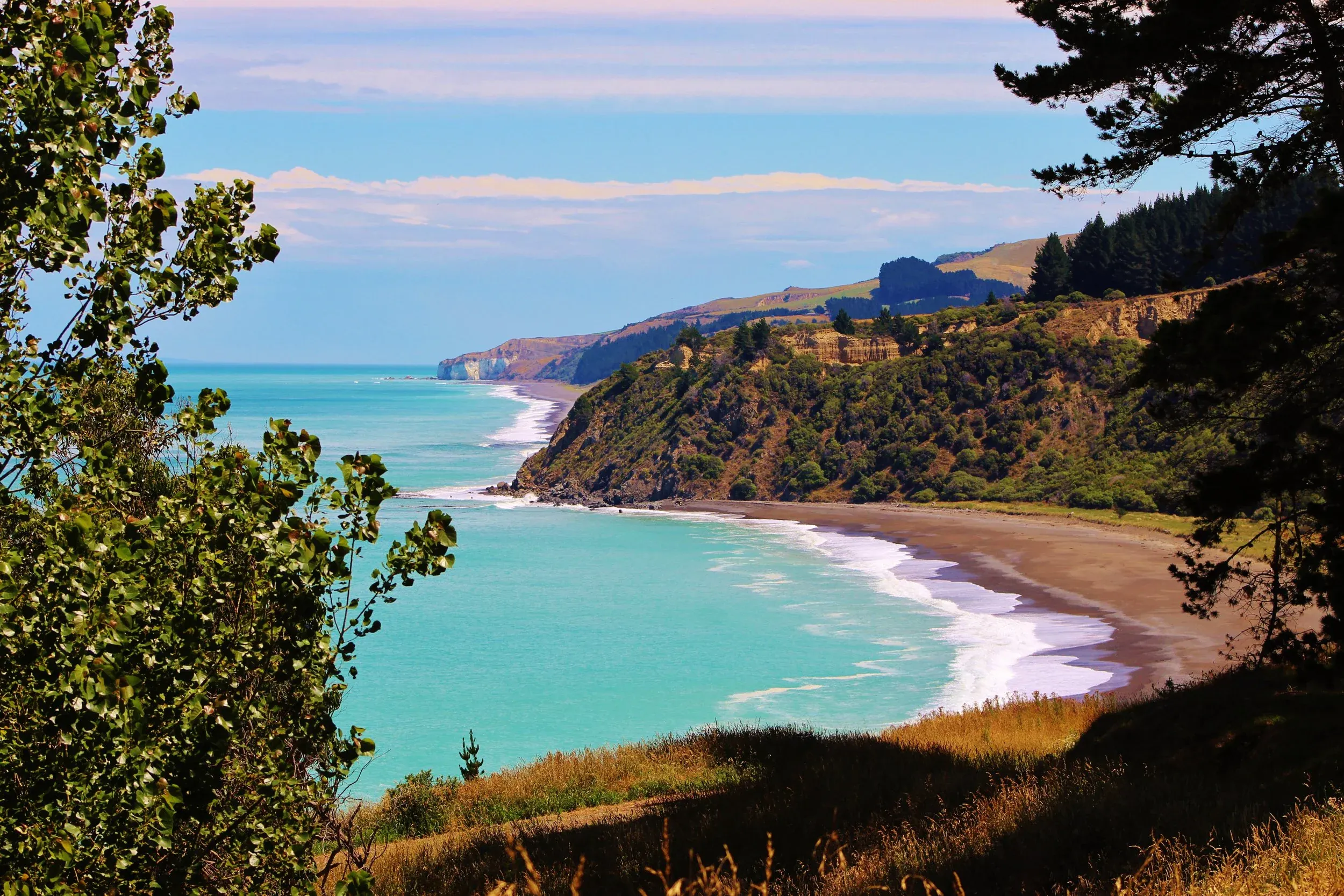 Stunning coastal cliffs and turquoise waters near Cheviot, a serene escape in North Canterbury.