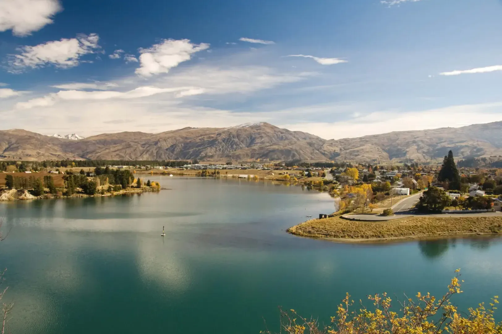 Cromwell lakefront and surrounding hills, a center for wineries and tourism services in Otago.