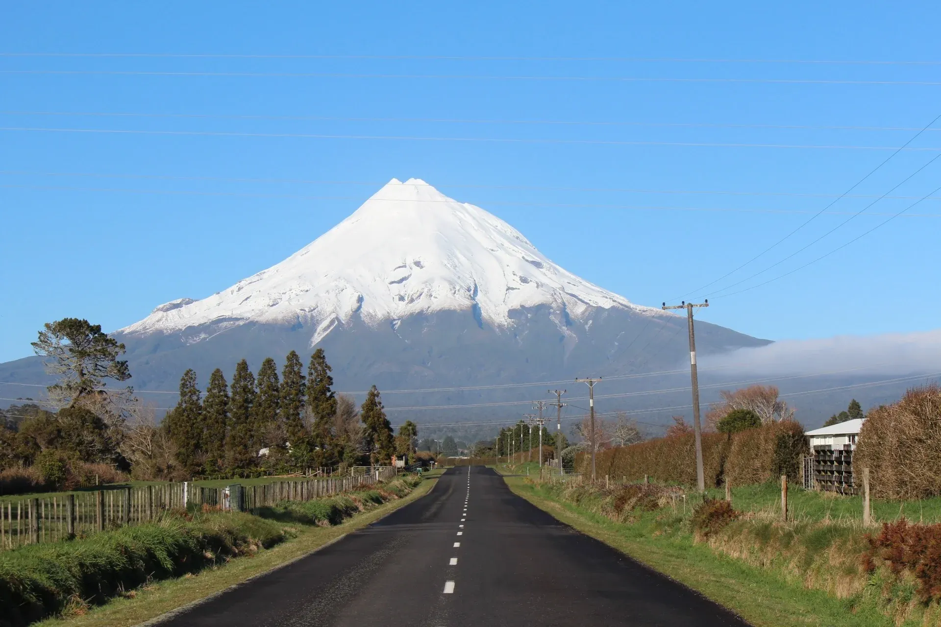 Egmont Village with Mt. Taranaki in the background, ideal for outdoor and tourism businesses.