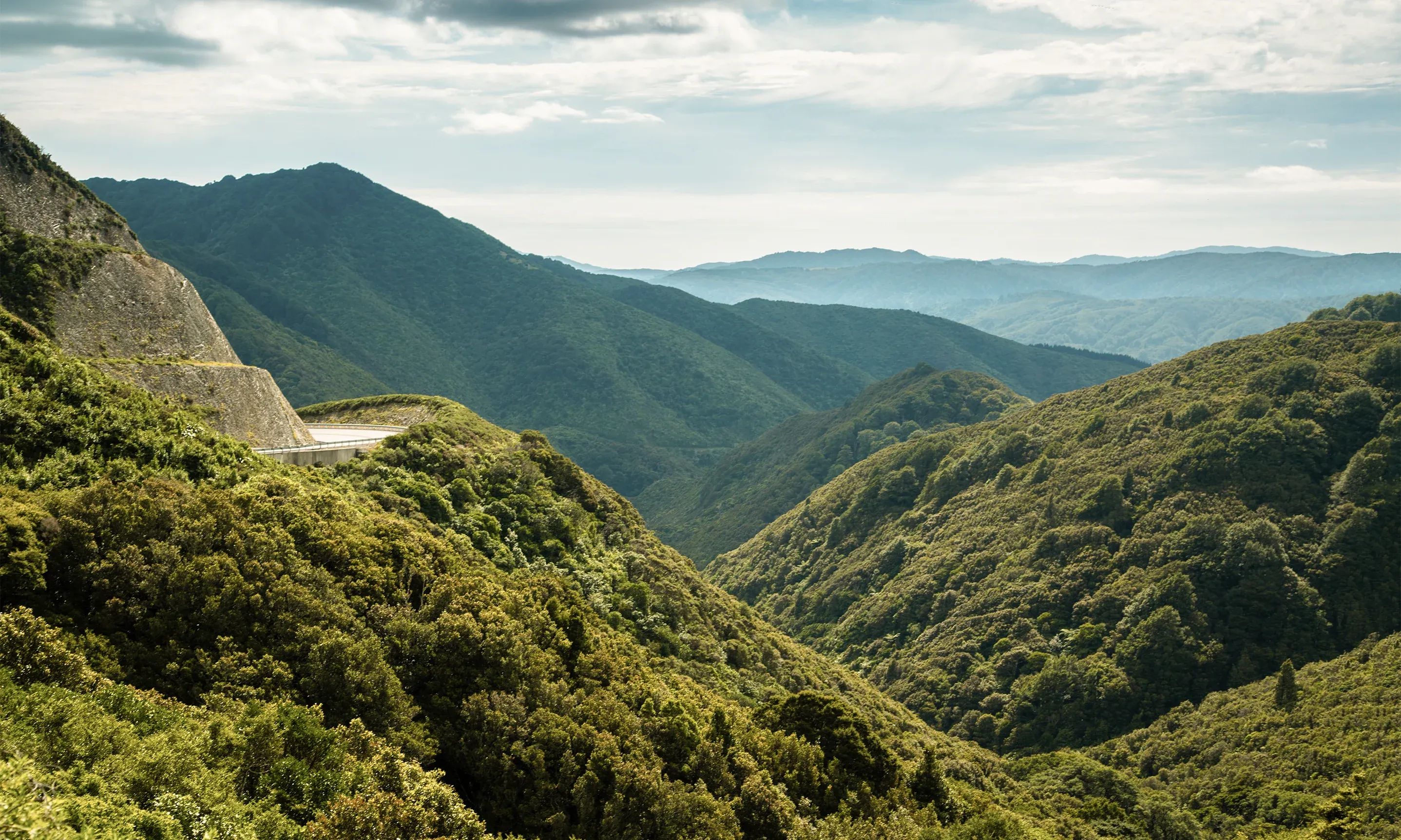 Featherston mountain views with winding road, a gateway for tourism and local services in Wairarapa.