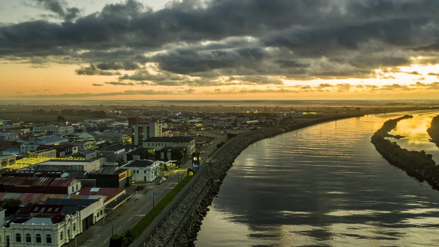 Greymouth coastal town with a thriving fishing industry and local businesses.