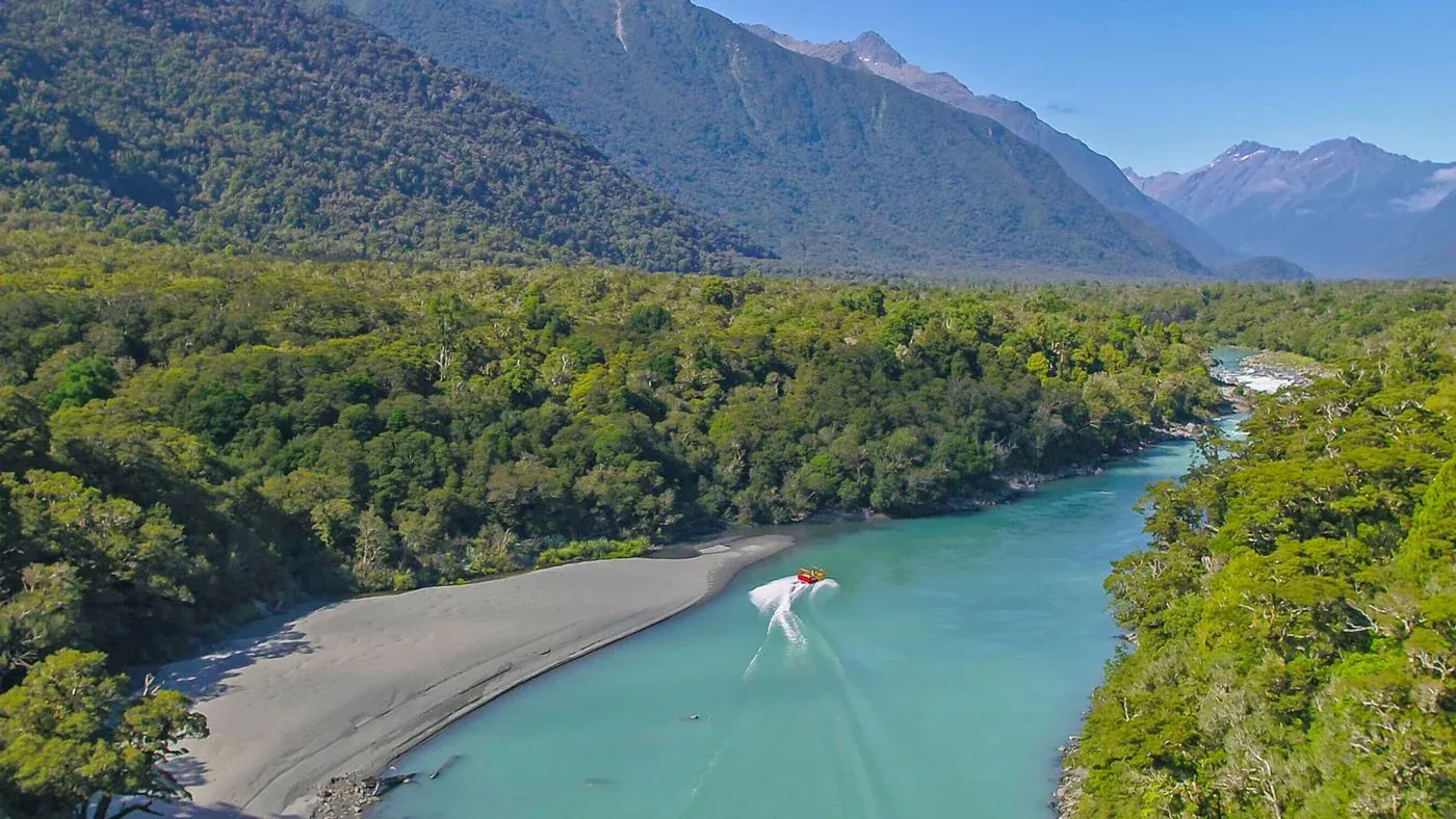 Haast riverside views, a gateway to eco-tourism and nature-focused businesses.