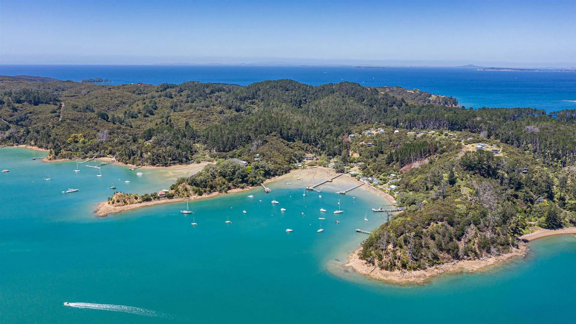 Kawau Island aerial view with turquoise bays, perfect for marine, tourism, and leisure businesses.