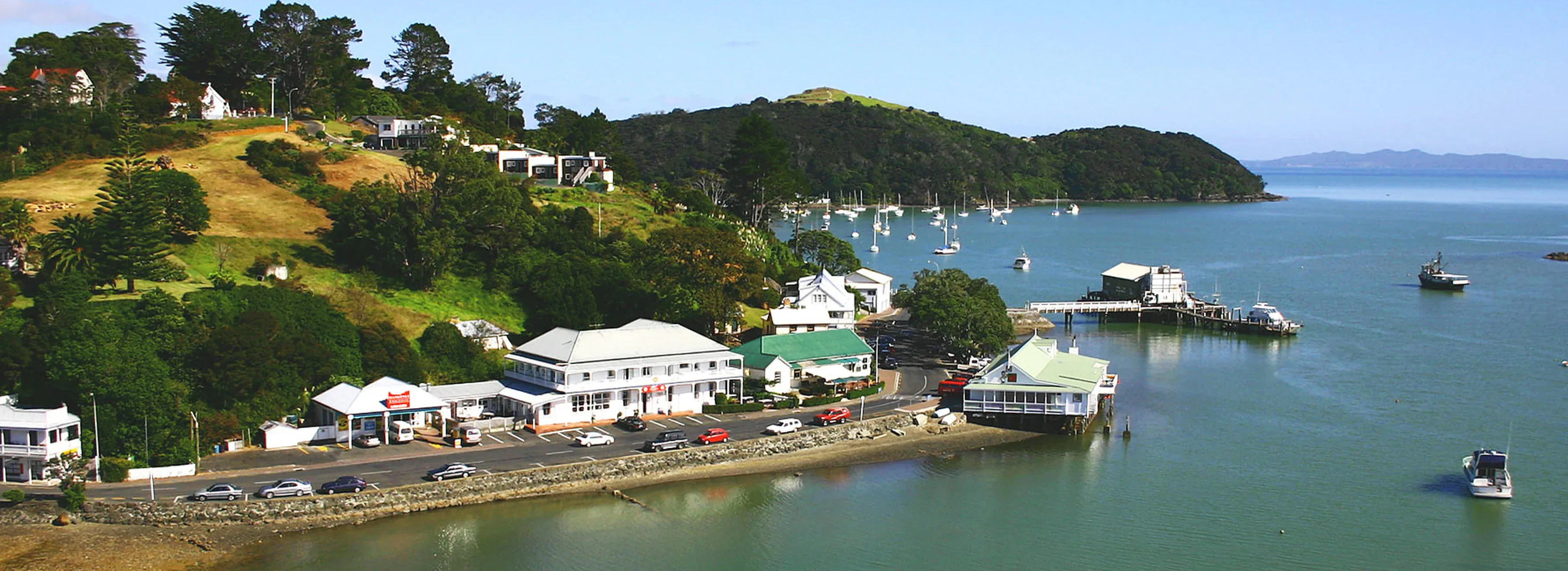 Mangonui waterfront with charming colonial buildings and fishing boats, Northland, New Zealand.