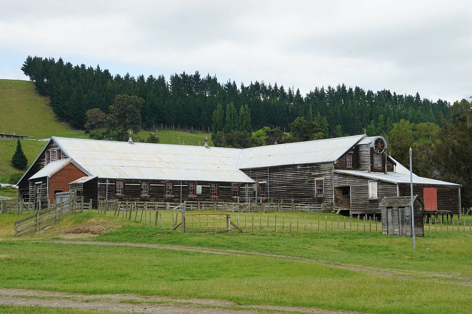 Historic woolshed surrounded by rolling hills in Maraekakaho, Hawke's Bay, New Zealand.