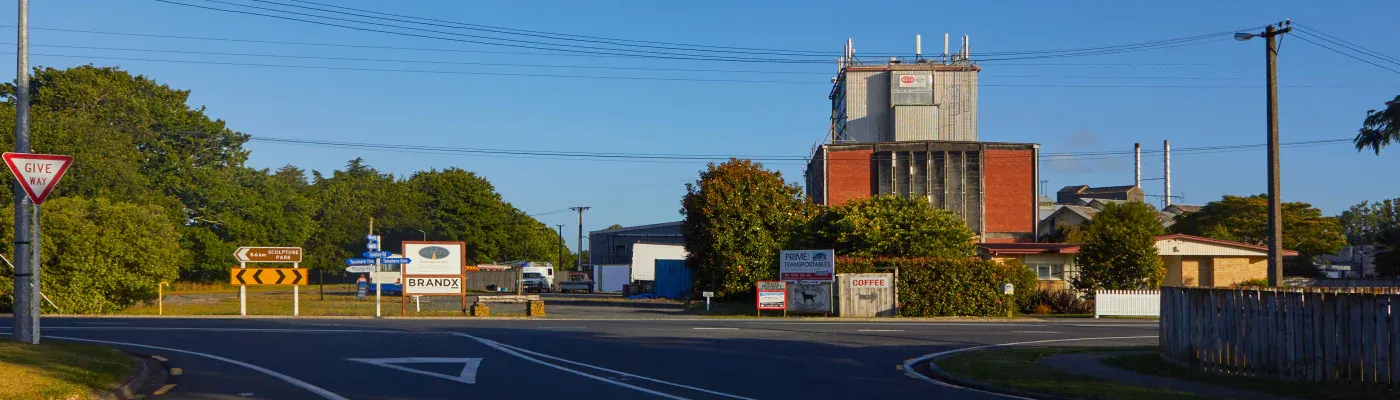 Tree-lined lake view in Matangi, Waikato, offering tranquil parks and a growing community for businesses.